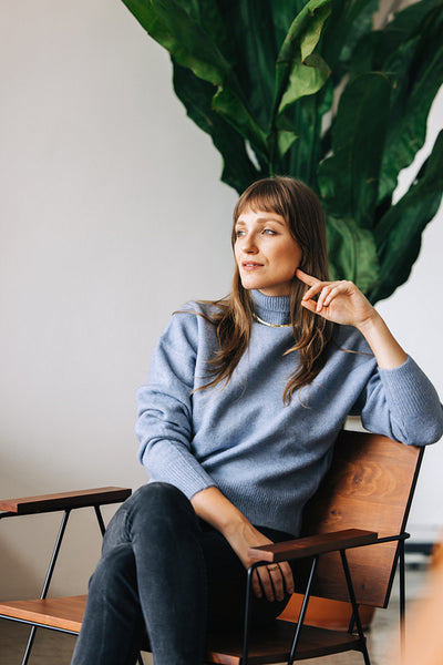 Young businesswoman looking away thoughtfully in an office