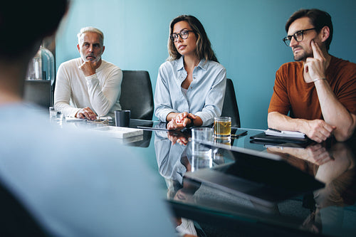 Caucasian business people listening attentively in a team meeting