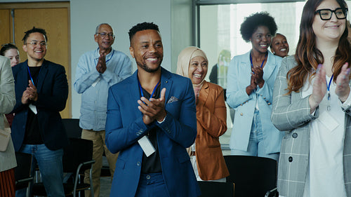Business professionals celebrating achievement and successful collaboration at a conference