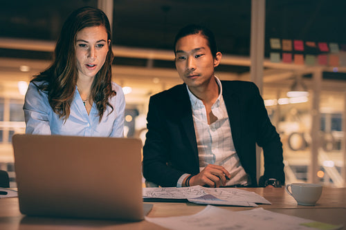 Business partners discussing work in office