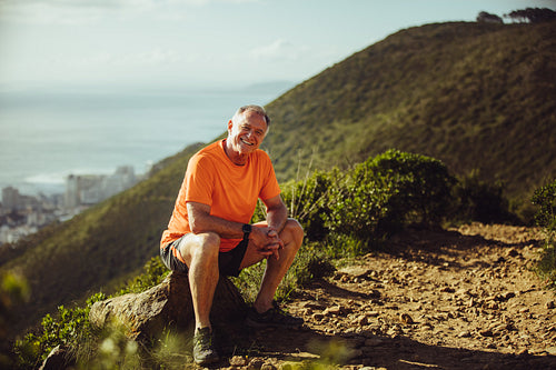 Senior athletic man relaxing after a run