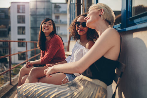 Female friends having fun in balcony