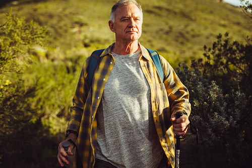 Portrait of a man hiking on a hill