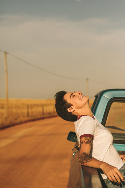 Woman enjoying on a road trip in her car