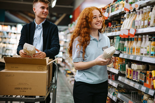 Grocery shop workers working in the store