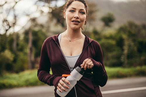 Female runner taking a break after workout