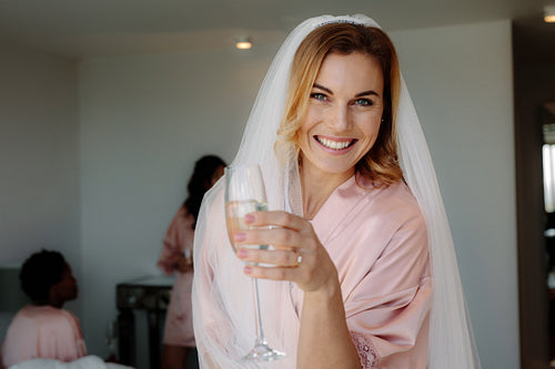 Bride celebrating hen party with friends at home