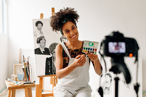 Painter recording an art tutorial in a studio