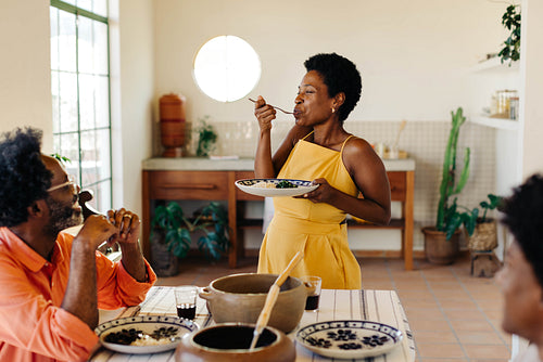 Traditional Brazilian family enjoying a homemade feijoada meal together