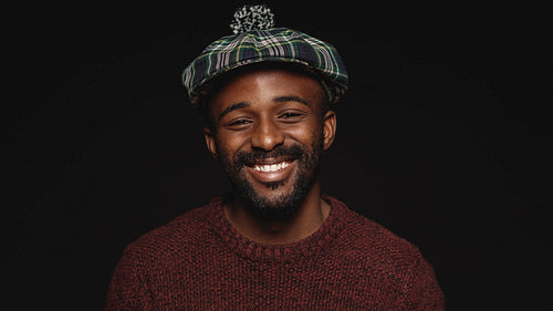 Close up of happy man in cap