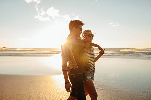 Beautiful young couple together on seashore