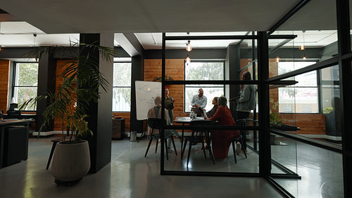 Teamwork in a diverse and inclusive coworking office: Multicultural professionals collaborating on a project