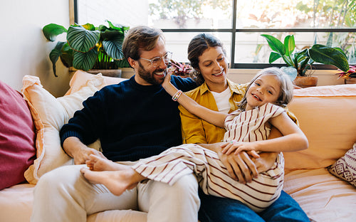 Family on couch enjoying moment together