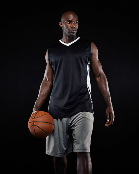 Portrait of basketball player on black background