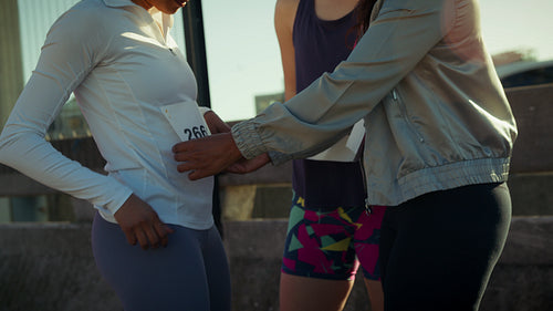 Happy runners prepare for an outdoor race