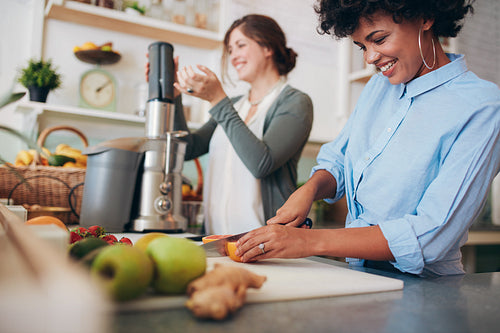 Two women working at juice bar