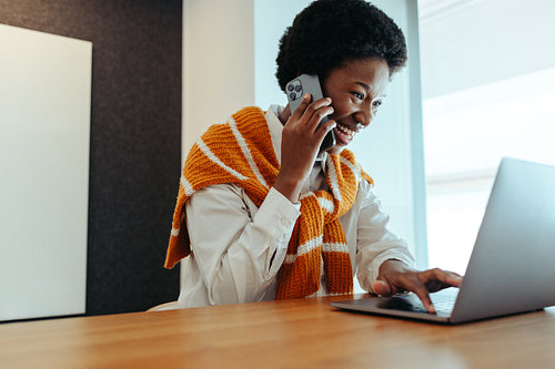 Smiling businesswoman using technology