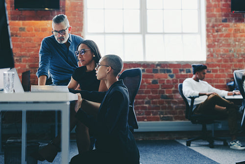 Creative businesspeople sharing ideas in a modern office