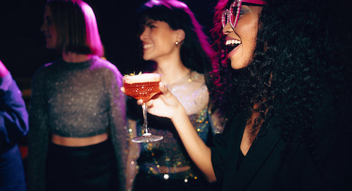 Group of friends enjoying a night out at a glamorous party