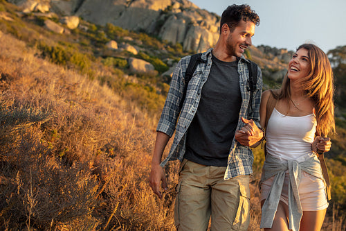 Happy young couple hiking together
