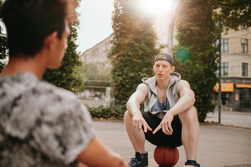 Basketball players taking break after a game