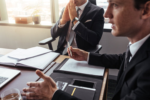 Businessman talking with someone during meeting