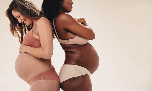 Moms-to-be embracing their journey of pregnancy with self-care and confidence