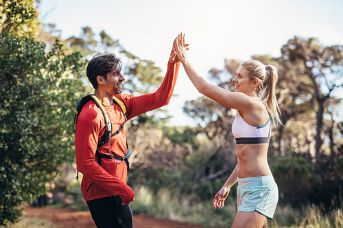 Athletic couple  celebrating after the run