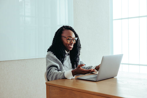 Creative professional engaging in a productive virtual meeting on a laptop
