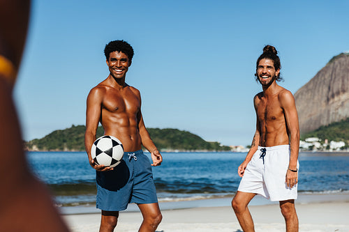 Friends enjoying a game of altinha on a beautiful Brazilian beach