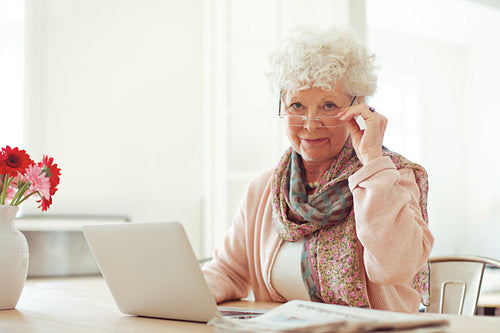 Senior Woman at Home Using a Laptop