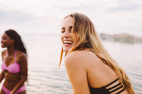 Girl friends having fun in the sea waters