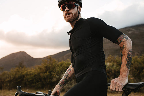 Bicycle rider taking a short break while training