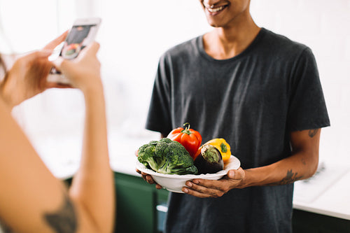 Anonymous couple making a food blog at home