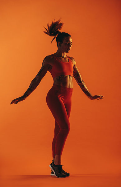 Fit woman doing warm up exercises