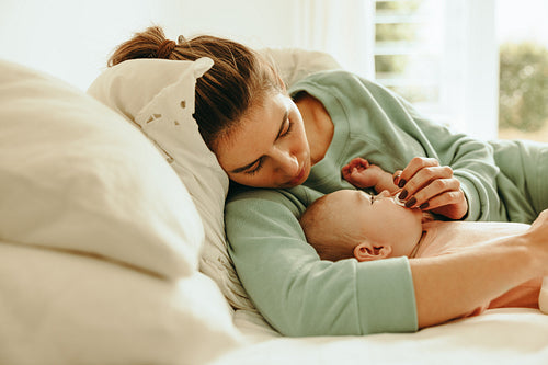 New mom giving her baby a dummy to suck on