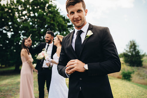 Handsome groom looking happy on his wedding day