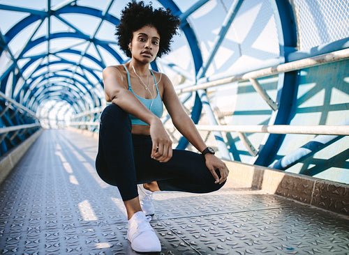 Female jogger taking a break