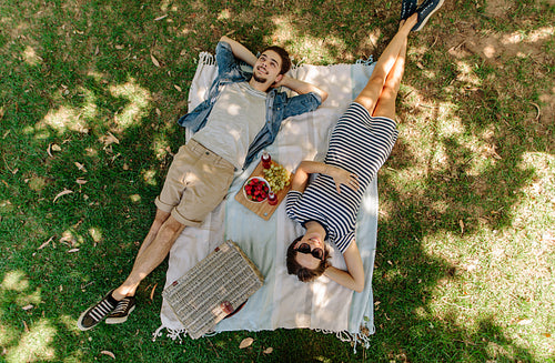 Couple relaxing on a picnic at park