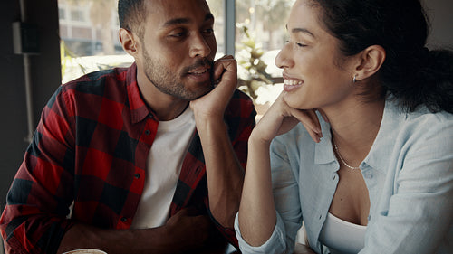 Happy couple enjoying dating in a cafe