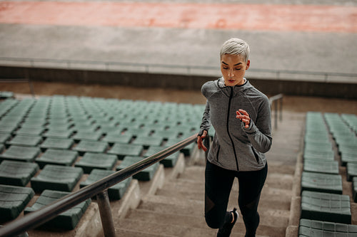 Fitness woman doing workout in  stadium