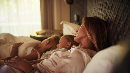 Peaceful morning with mother and children in a luxurious island resort villa