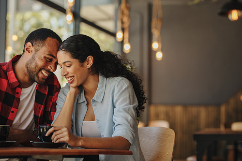 Couple enjoying their date at a local coffee shop