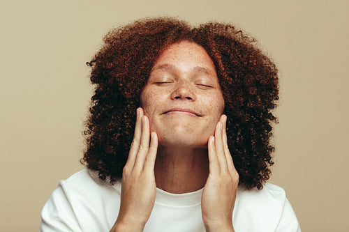 Feeling good in his own skin: Man embracing his freckles after his skincare routine