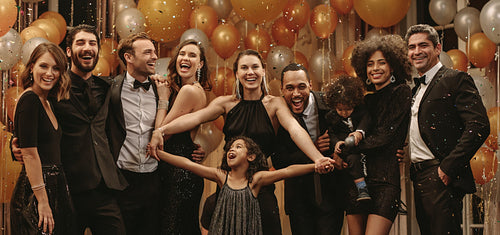 Friends having a group photo at glamourous night