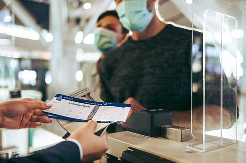 Airlines staff working at check in counter during pandemic