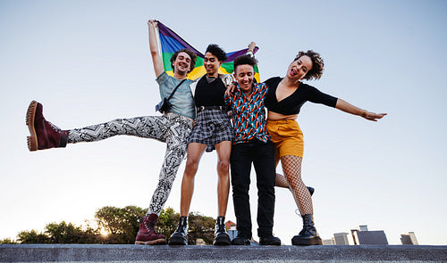 Group of young queer people celebrating pride together