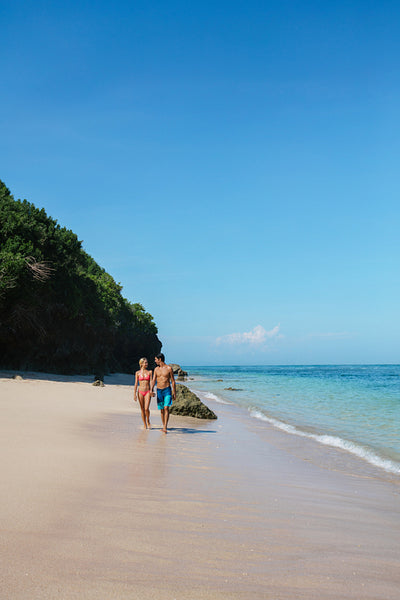 Young couple strolling on the beach