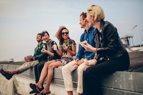 Happy young people partying on roof