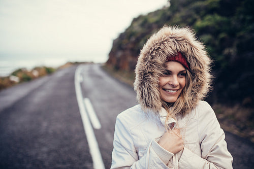 Beautiful smiling woman on open highway